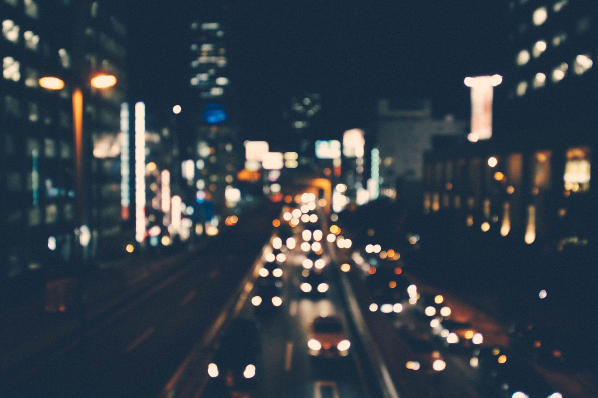 Blurred car lights in evening city traffic